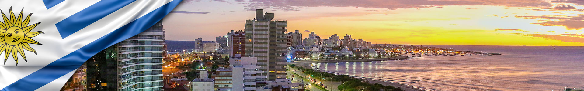 Bandera de Uruguay, vista aérea sobre Punta del Este y el Océano Atlántico al atardecer. Uruguay.